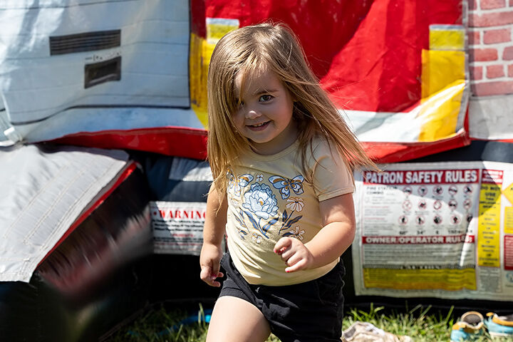 Naomi Brooks, 3, of Blackwell plays on the bouncy house.